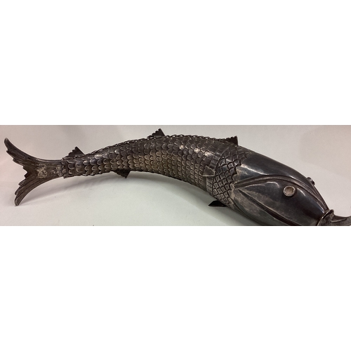 437 - A large and heavy Antique silver articulated figure of a fish. Approx. 238 grams. Est. £400 - £600.