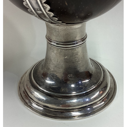 447 - A rare West Country silver mounted coconut cup. Maker's mark only. Bideford/Barnstable. Circa 1710. ... 