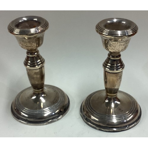 483 - A pair of silver candlesticks. Birmingham. Approx. 248 grams of gross weight. Est. £60 - £80.