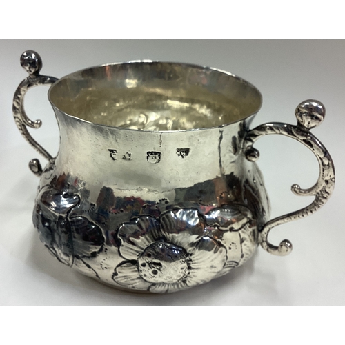 486 - A fine 17th Century silver porringer with crested decoration to body. Circa 1670. By Nathaniel Weekl... 