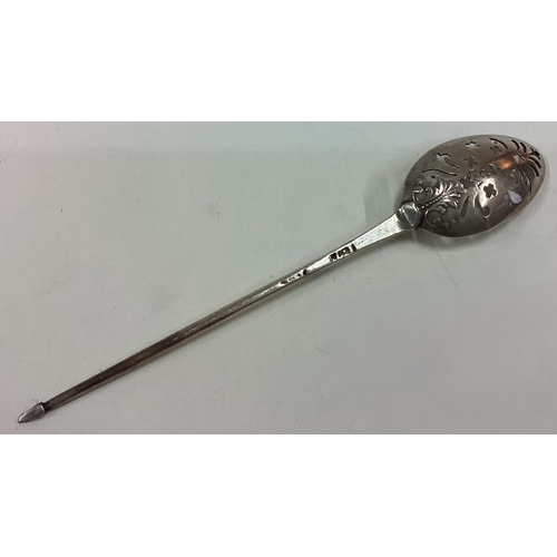 499 - An 18th Century silver mote spoon with finely pierced and embossed terminal. Maker's mark only struc... 