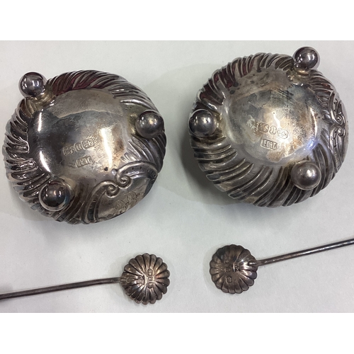 502 - A boxed pair of silver salts with fluted decoration together with matching spoons. Birmingham. Appro... 