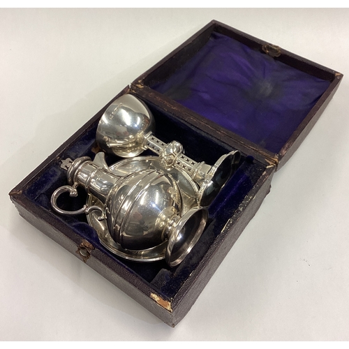 503 - A good cased silver three-piece communion set. Sheffield. By HW. Approx. 158 grams. Est. £120 - £150... 