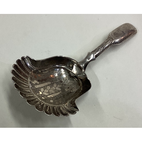 517 - A 19th Century silver caddy spoon with bright-cut decoration to bowl. Approx. 10 grams. Est. £20 - £... 