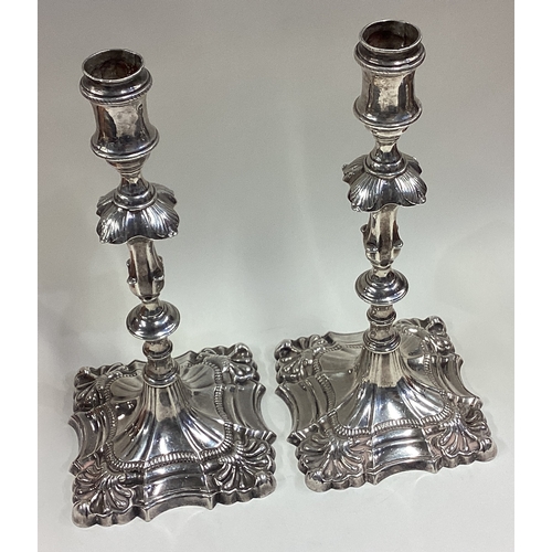 530 - A large pair of 18th Century cast silver candlesticks. London 1771. By John Arnell. Approx. 1050 gra... 