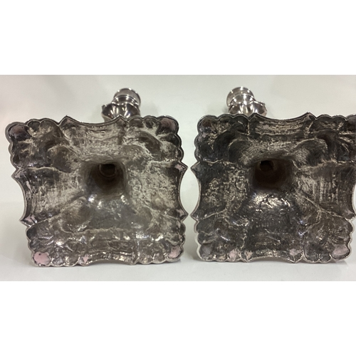 530 - A large pair of 18th Century cast silver candlesticks. London 1771. By John Arnell. Approx. 1050 gra... 