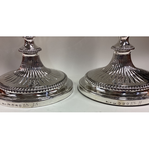 533 - A fine and attractive pair of George III silver candlesticks. Sheffield 1801. By Nathaniel Smith & C... 