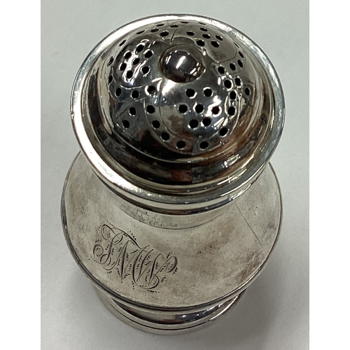 54 - An 18th Century George II silver caster. London 1739. Approx. 65 grams. Est. £150 - £200.