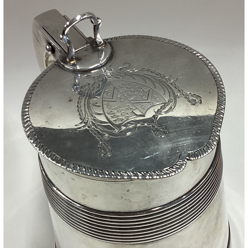 541 - A large and impressive silver lidded tankard of barrelled form with fine coat of arms to cover. Lond... 