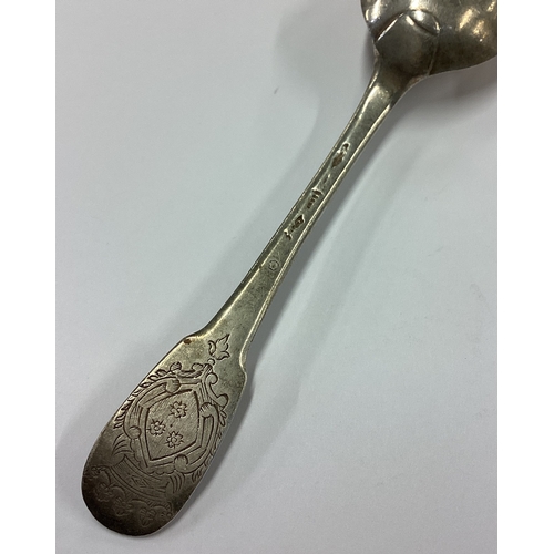 56 - An 18th Century French silver spoon decorated with central armorial. Approx. 22 grams. Est. £30 - £4... 