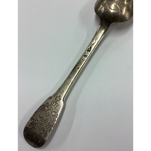 57 - An 18th Century French silver spoon decorated with central armorial. Approx. 28 grams. Est. £30 - £4... 