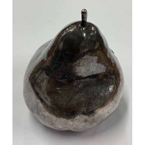 576 - A silver model of a pear. Approx. 127 grams. Est. £30 - £40.