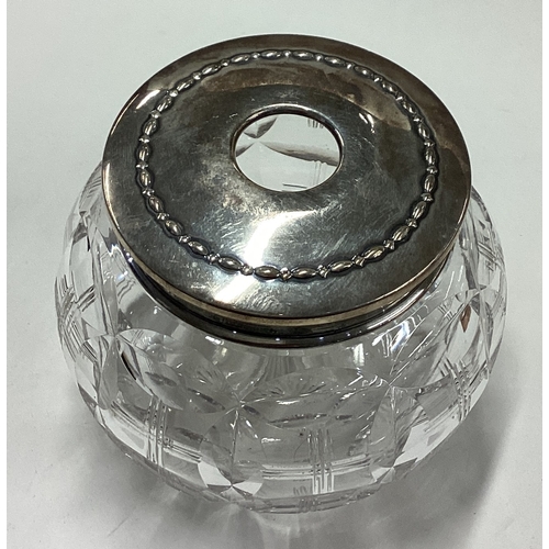 58 - A silver mounted and glass string holder. Sheffield. Circa 1920. Est. £40 - £60.