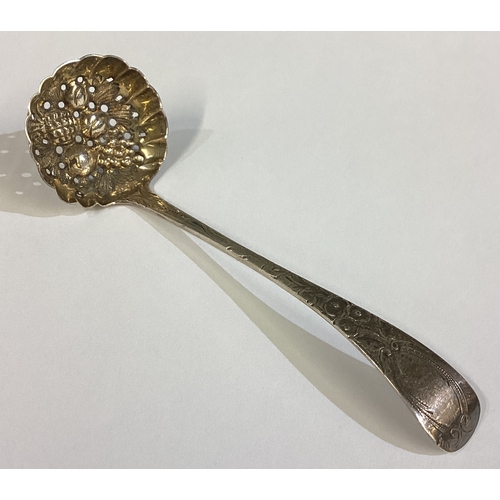 584 - A 19th Century George III silver sifter ladle with berry decoration. London 1810. Approx. 19 grams. ... 