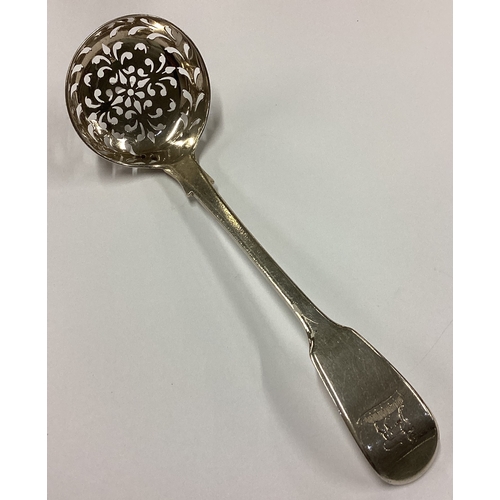 586 - A 19th Century George III silver sifter spoon decorated with lion crest. London 1815. By William Cha... 