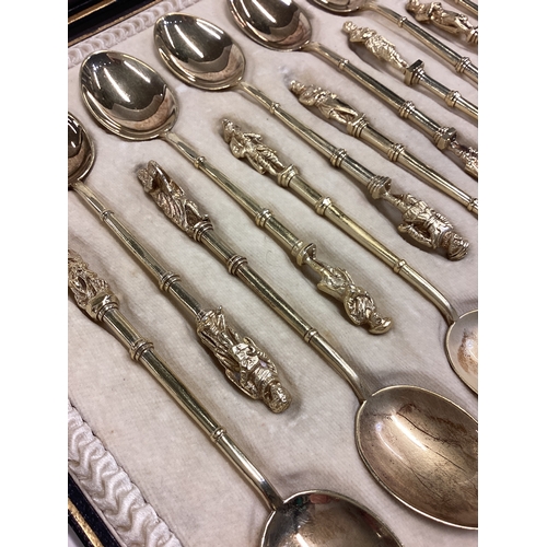 600 - A good set of twelve silver gilt Apostle top spoons with bamboo design to terminals contained within... 