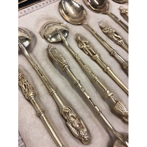 600 - A good set of twelve silver gilt Apostle top spoons with bamboo design to terminals contained within... 