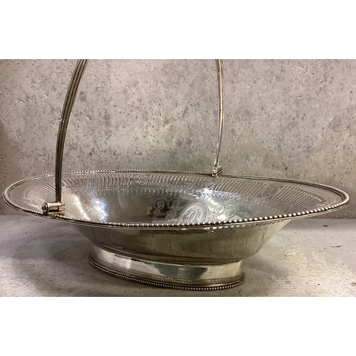 607 - An attractive 18th Century George III silver swing handled basket with pierced and bright-cut decora... 