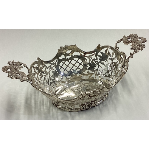 609 - A decorative 19th Century Dutch silver basket with embossed floral and pierced decoration. Marked to... 