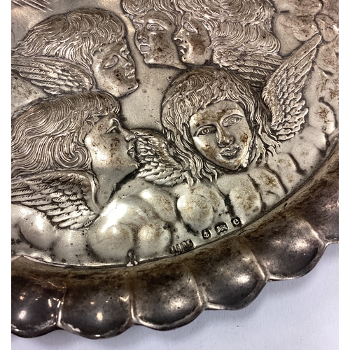 611 - A silver card tray embossed with cherubs. Birmingham 1904. By Henry Mathews. Approx. 60 grams. Est. ... 