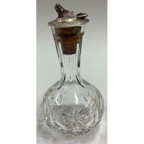 612 - OF HUNTING INTEREST: A silver mounted and glass whisky liqueur bottle. London 1977. Est. £60 - £80.