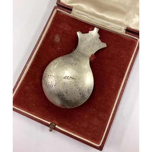 624 - R E STONE: A cased silver and enamelled caddy spoon contained within Goldsmiths & Silversmiths retai... 