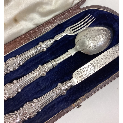 627 - A cased silver three-piece christening set with engraved decoration. Birmingham 1856. By George Unit... 