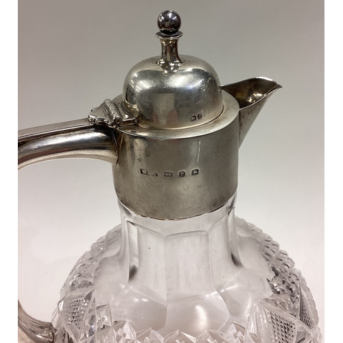 630 - A Victorian silver mounted and glass claret jug. Birmingham 1898. By WFL. Est. £200 - £300.