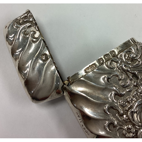 635 - A decorative Victorian silver vesta case of fluted design embossed with floral decoration . Sheffiel... 