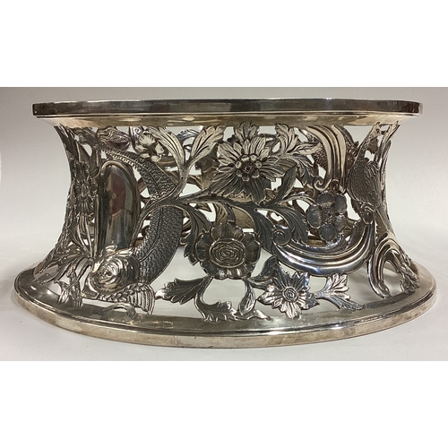 636 - CHESTER: A fine pierced silver ring dish decorated with birds in the Chinoiserie style. 1910. By Geo... 