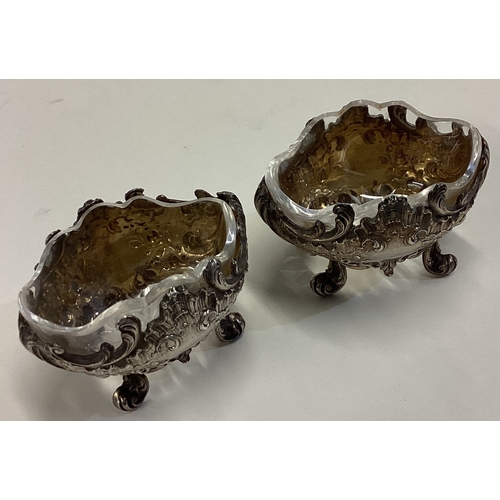 637 - A pair of Naturalistic French silver salts with glass liners. Marked 950. Approx. 46 grams. Est. £50... 