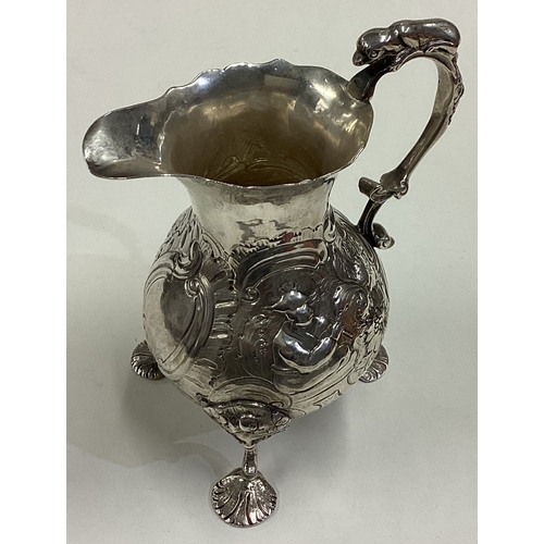 641 - An unusual Naturalistic 18th Century George III Chinoiserie silver jug chased with flowers and Orien... 