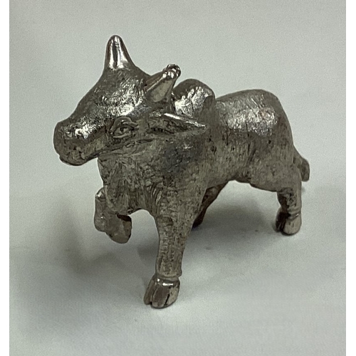 657 - A Chinese silver figure of a cow. Approx. 51 grams. Est. £60 - £80.