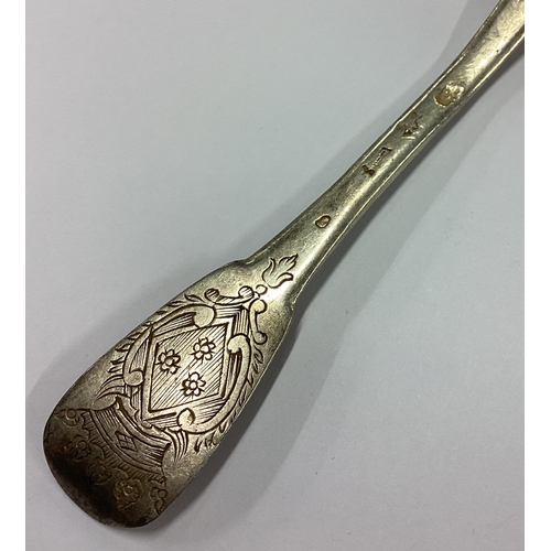 66 - An 18th Century French silver spoon with central armorial. Approx. 25 grams. Est. £30 - £40.