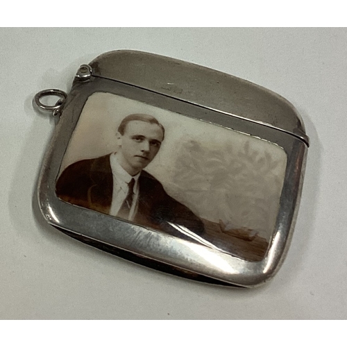 683 - A silver and enamelled vesta case decorated with a portrait of a man. Birmingham 1916. By Horace Woo... 