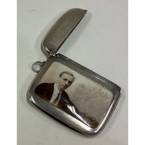 683 - A silver and enamelled vesta case decorated with a portrait of a man. Birmingham 1916. By Horace Woo... 