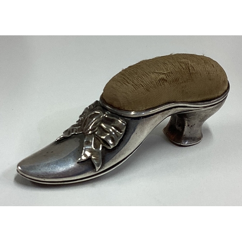 688 - A silver pin cushion in the form of a lady's shoe. Birmingham 1906. Approx. 40 grams. Est. £60 - £80... 