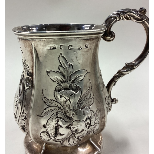 69 - An embossed Victorian silver mug. London. By George Reilly & Edward Barnard. Approx. 57 grams. Est. ... 