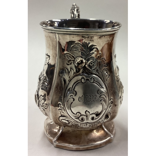 69 - An embossed Victorian silver mug. London. By George Reilly & Edward Barnard. Approx. 57 grams. Est. ... 