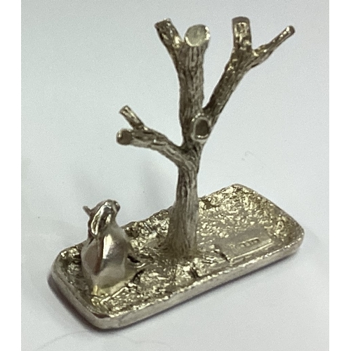 698 - A Naturalistic silver ring tree cast with rabbit. Approx. 43 grams. Est. £40 - £60.