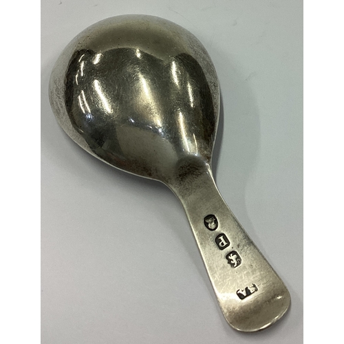 702 - A Victorian silver caddy spoon bearing English import marks. Circa 1890. Approx. 12 grams. Est. £40 ... 