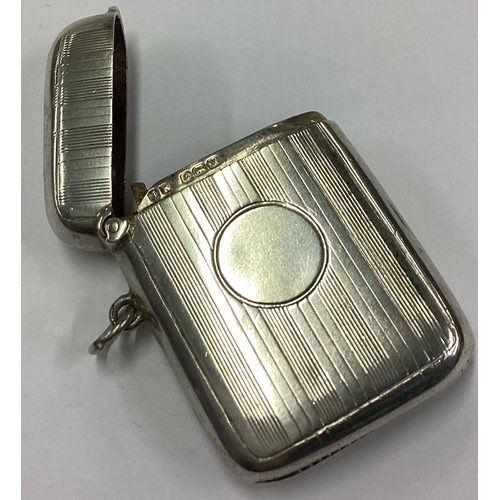 707 - An engine turned silver vesta case. Birmingham 1923. Approx. 26 grams. Est. £20 - £30.