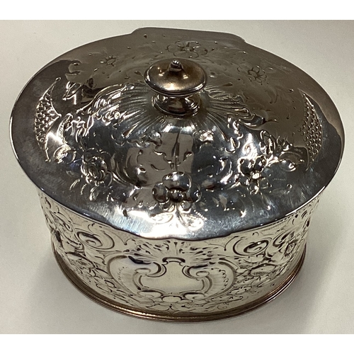 709 - A Victorian silver tea caddy with hinged cover embossed with floral decoration. London 1888. Approx.... 