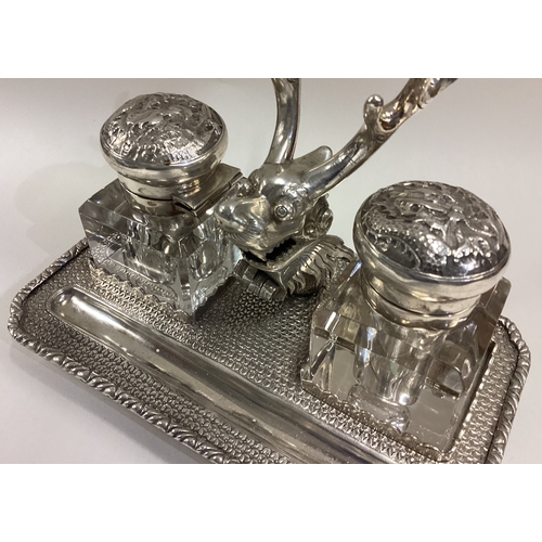 717 - A rare Chinese export silver inkwell chased with dragon decoration and unusual cast dragon with horn... 