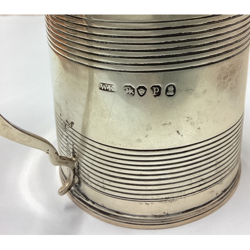 729 - A heavy silver barrel-shaped christening cup. London. By WH. Approx. 89 grams. Est. £60 - £80.