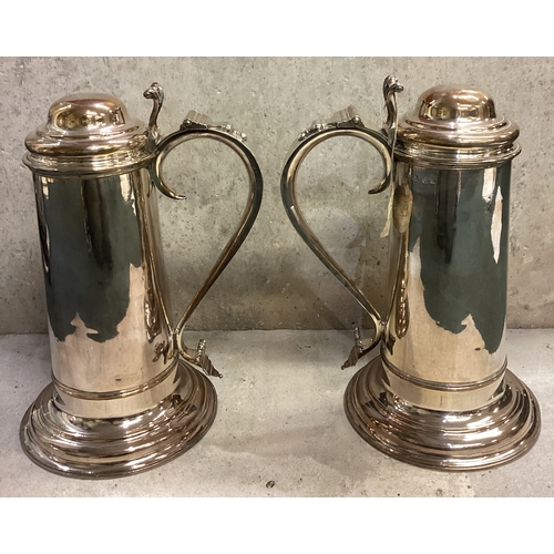 749 - A pair of George II silver flagons each of plain cylindrical form, with domed hinged lid, pierced an... 