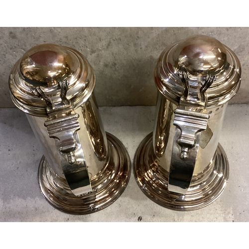 749 - A pair of George II silver flagons each of plain cylindrical form, with domed hinged lid, pierced an... 