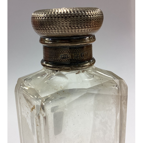 83 - An engine turned silver scent bottle. Circa 1930. Est. £30 - £40.