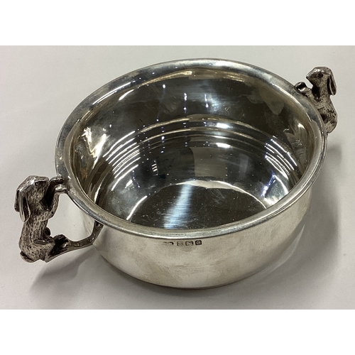 97 - A child's silver bowl cast with figural rabbit handles. Birmingham 1927. By S&M. Approx. 155 grams. ... 