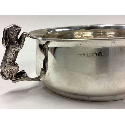 97 - A child's silver bowl cast with figural rabbit handles. Birmingham 1927. By S&M. Approx. 155 grams. ... 